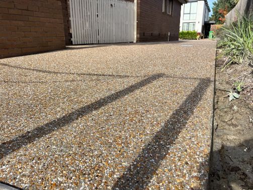 Concreters Aspendale used an exposed aggregate to build this concrete driveway Aspendale