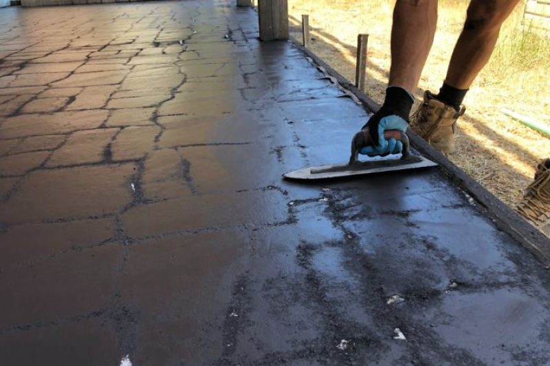 Concreters Frankston finishing stenciled concrete at a job in Seaford